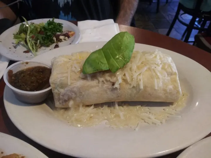 The Emerald Bay Burrito, smothered in cheddar with house made salsa