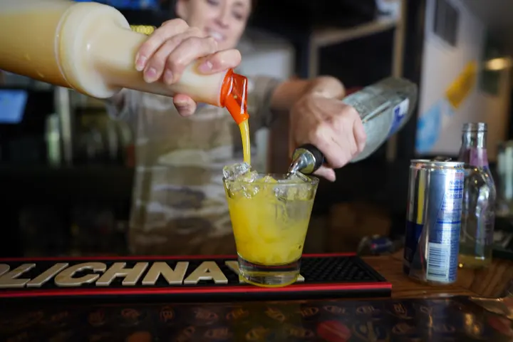 Mixing a cocktail at the bar