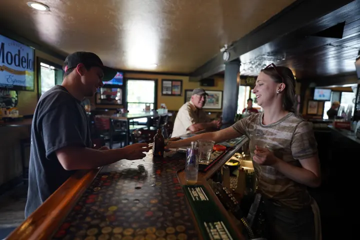 Guests at the bar on a busy afternoon