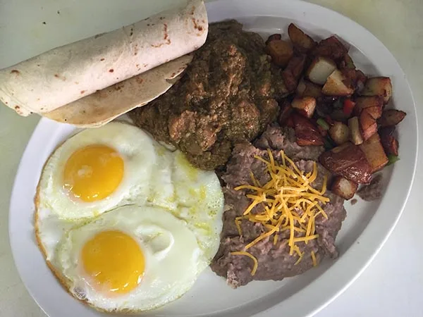 Chicken fried steak and eggs with homefries