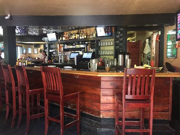 The main bar, stools and taps inside Emerald Bay Bar & Grill