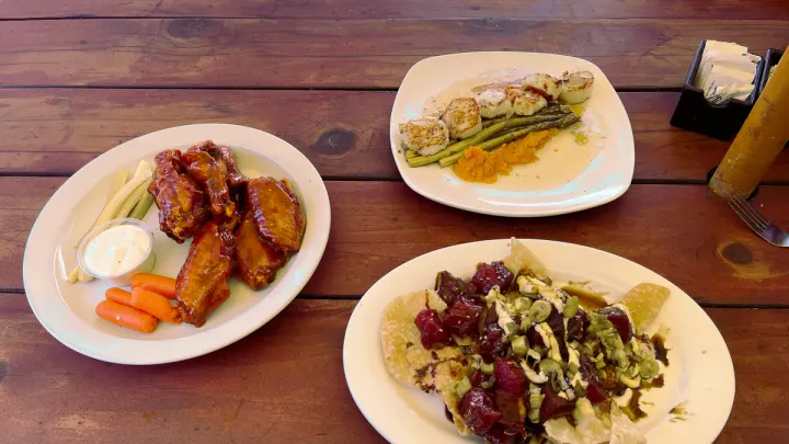Wings, seared scallops and a loaded nacho plate