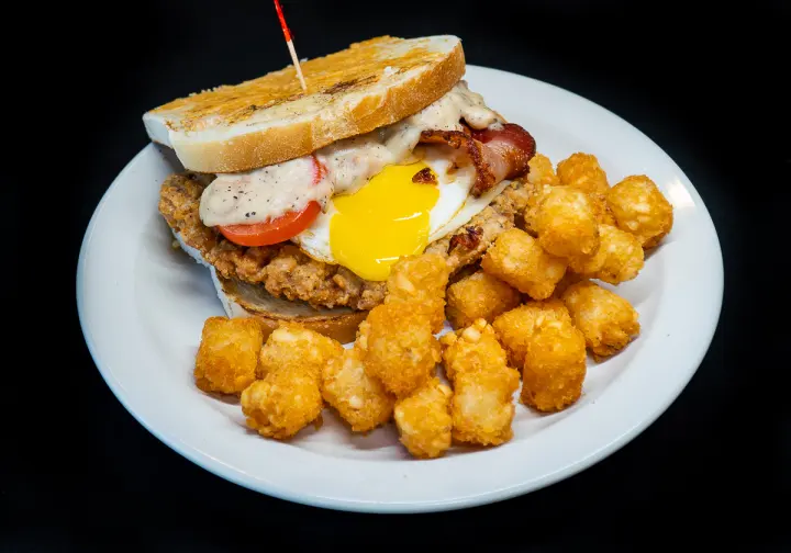 The Summit Sandwich — chicken fried steak with fried egg on parmesan crusted sourdough